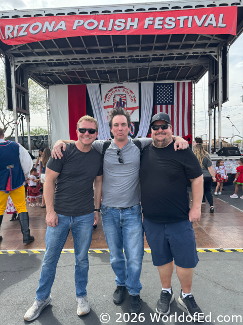 3 friends standing together at the festival.