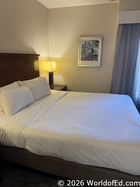 The bedroom with a king bed in the center.